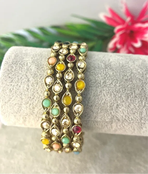 Four antique gold multicolour stone studded kangan